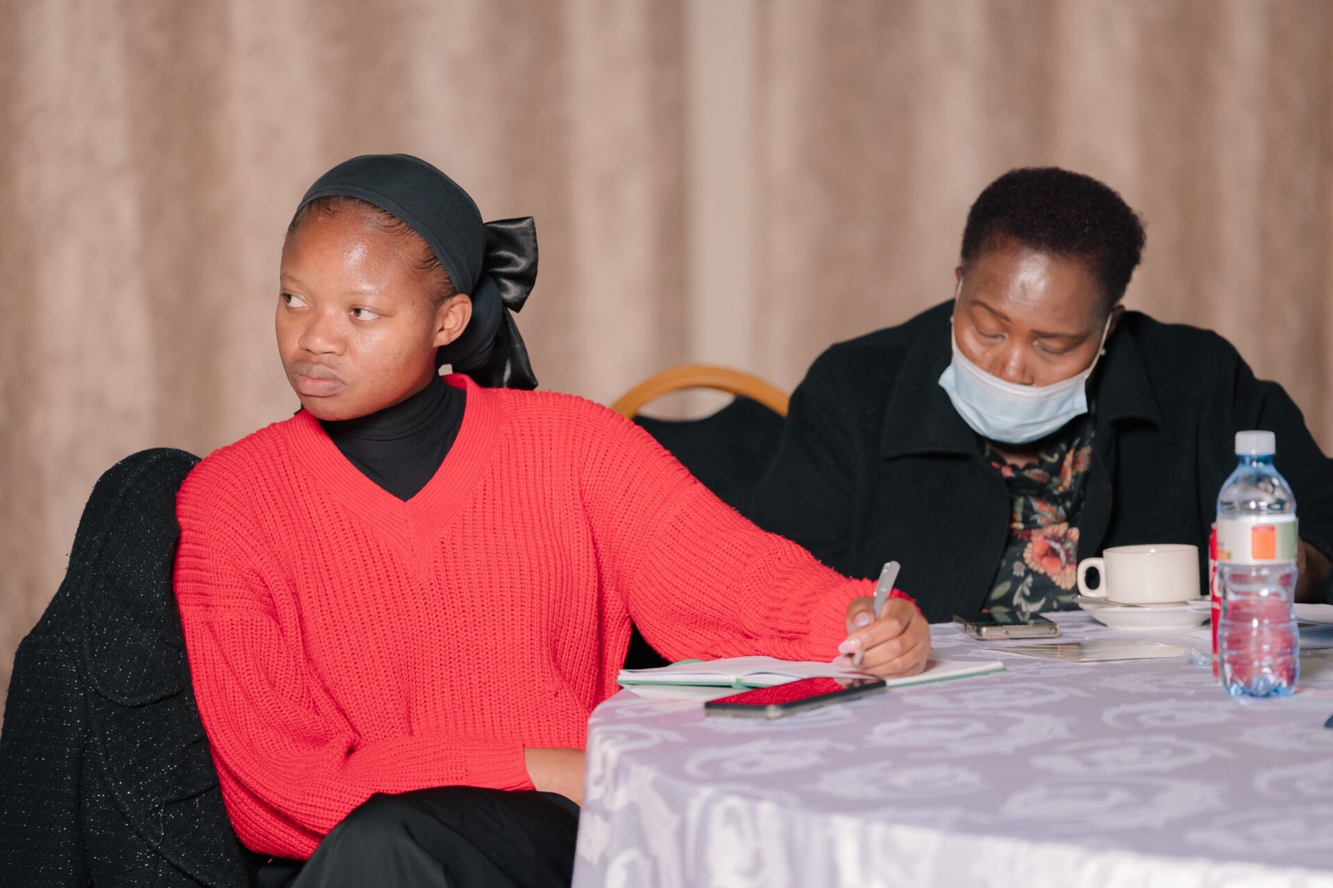Participants take notes at an ESGM dialogue, 2024